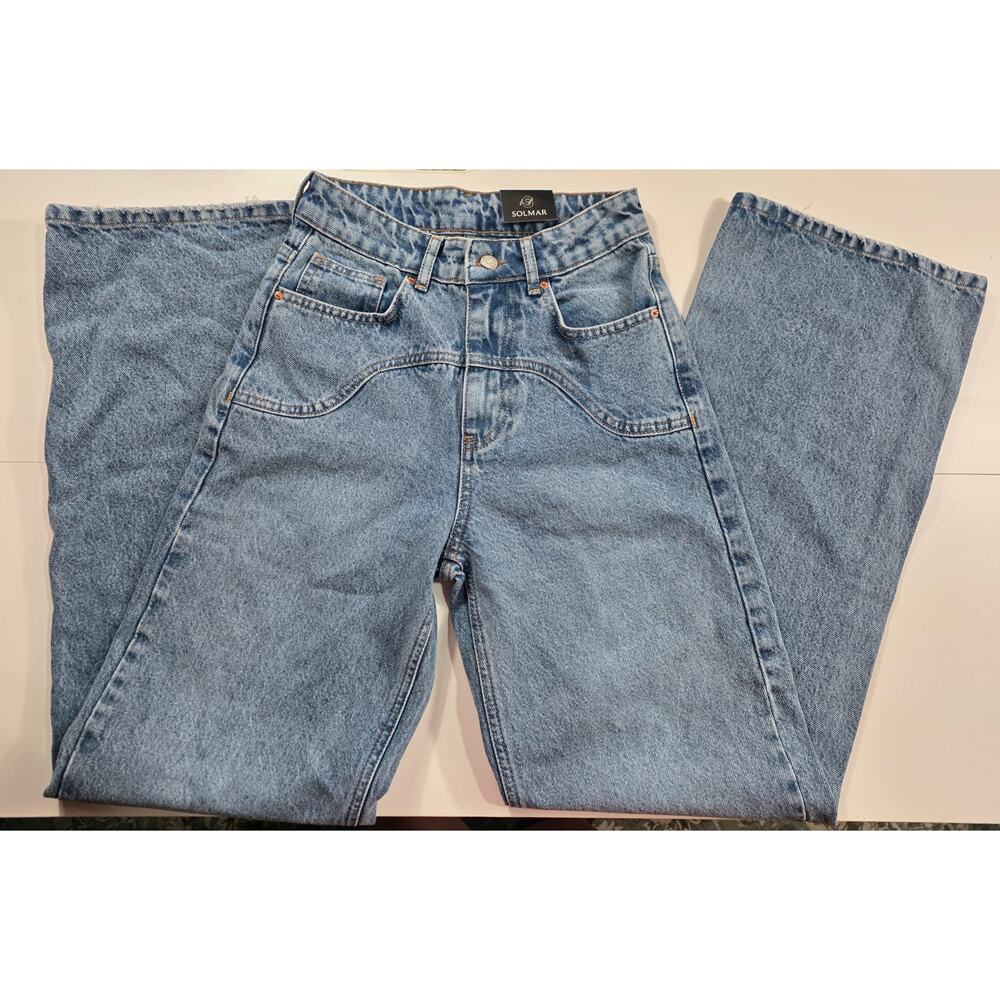 Solmar medium wash high-waisted jeans with wide legs.US26